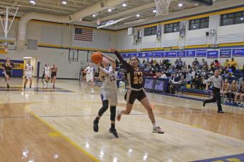 Photo by Christopher Lugo/Staff HHS senior Hayley Borino fights for a layup against Cherokee on Friday night. 
