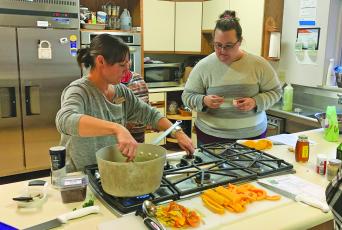 Jenna Kranz (left), from Uncomplicated Kitchen in Sylva, is teaching classes focused on making a Thanksgiving meal on a budget for families on the Highlands-Cashiers Plateau.