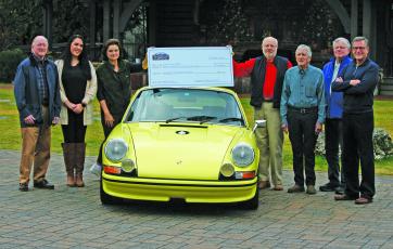 Representatives of the Highlands Motoring Festival presented a check to three area nonprofit on Thursday.
